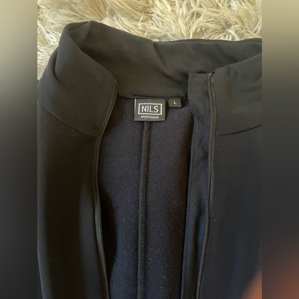 NILS Women’s Black Ski Suit. This is not waterproof and is a polyester onesie